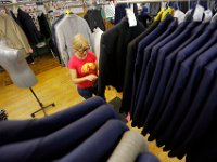 Mina Afonso, checks for any irregularities in completed suits before they are shipped, at the Joseph Abboud manufacturing plant in New Bedford, MA.   [ PETER PEREIRA/THE STANDARD-TIMES/SCMG ]